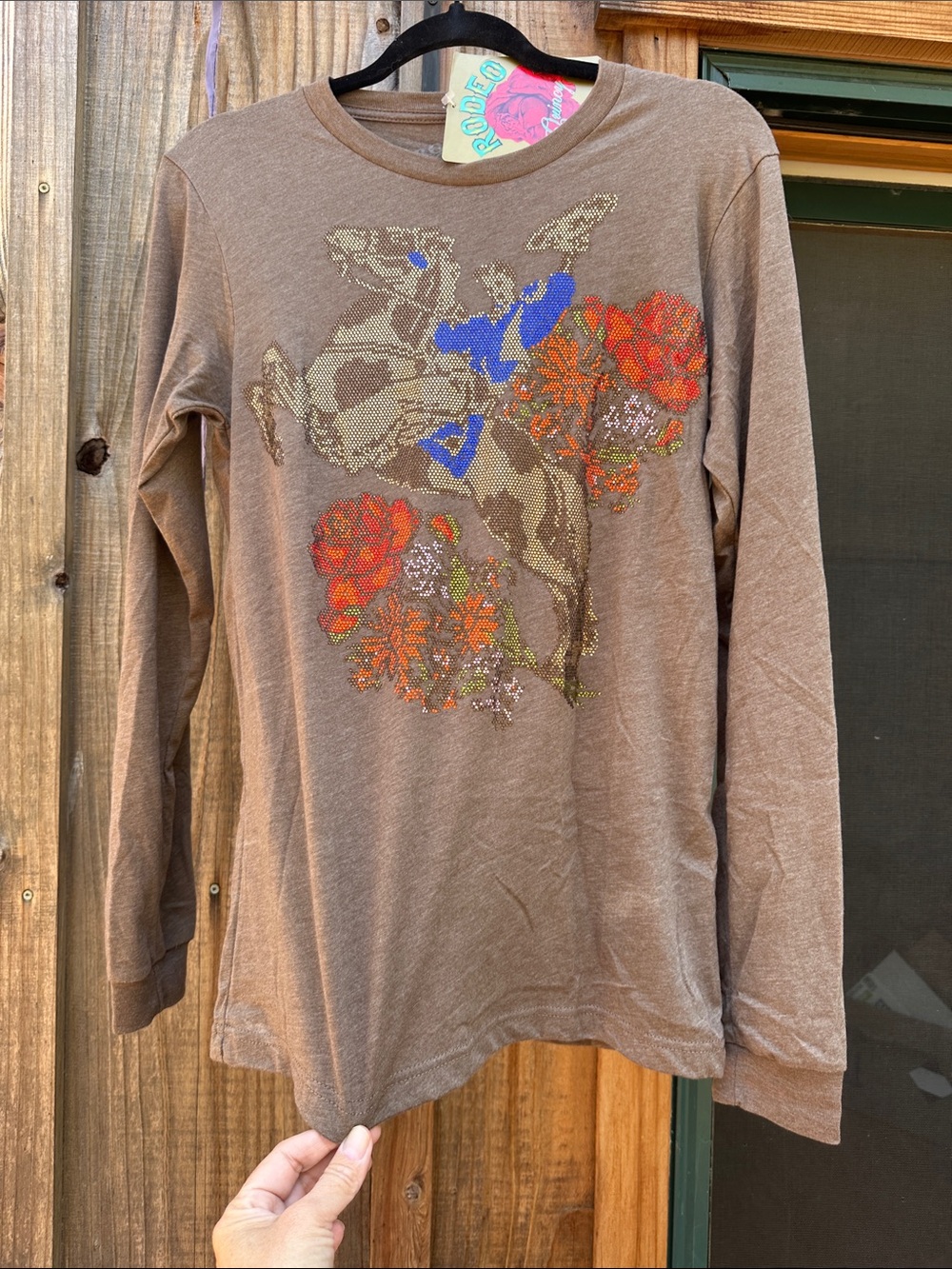 Rodeo Quincy women’s Long-Sleeve Brown Graphic Tee w rhinestone cowboy on horse